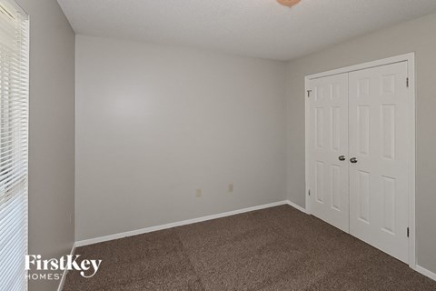 the living room of a home with a white door