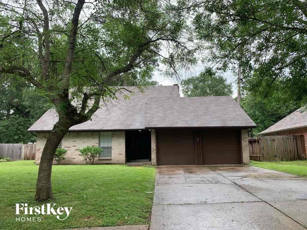 the front of a house with a garage door