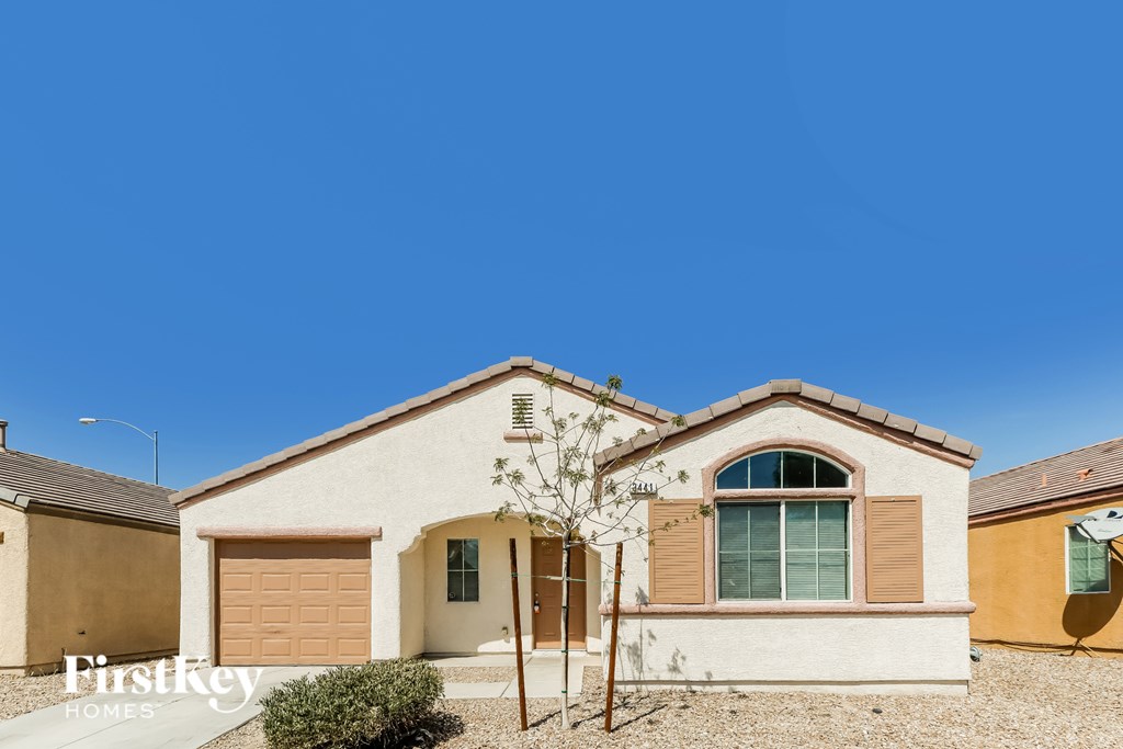 A house with a brown garage door is for sale.
