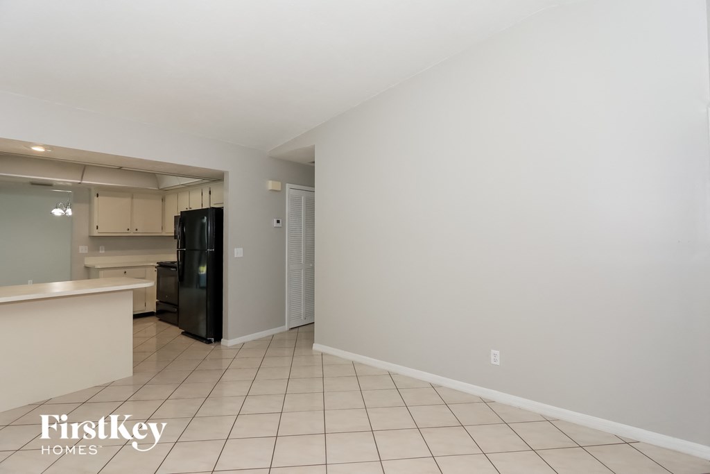 a kitchen with a refrigerator and a sink and a