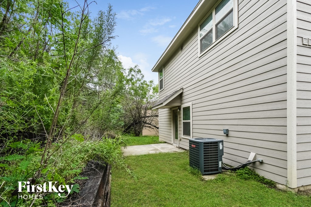 A house with a FirstKey Homes sign on the side.