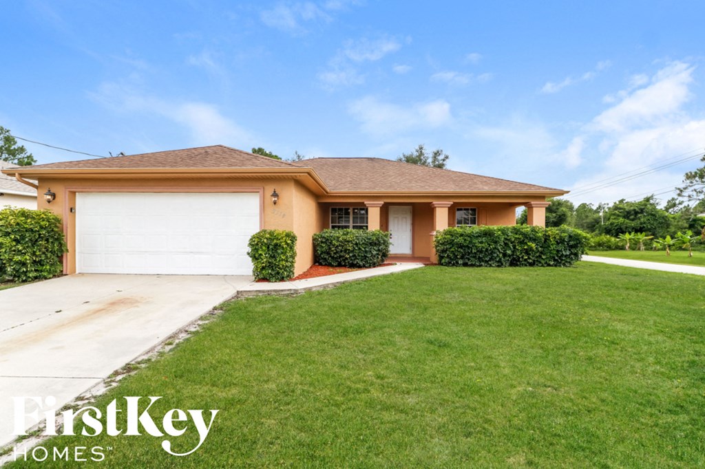 A house with a brown roof and a white garage door.