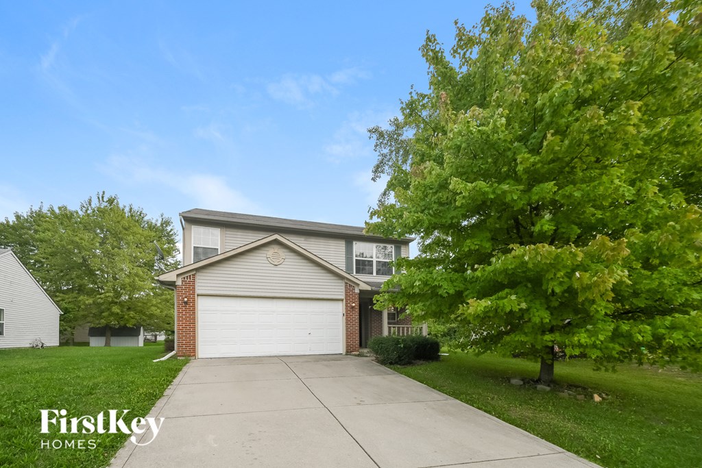A house with a garage is for sale by FirstKey Homes.