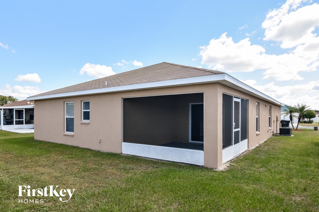 a new manufactured home with a covered porch and a garage