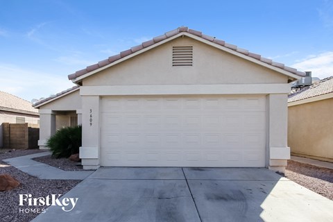 a white garage door in front of a house