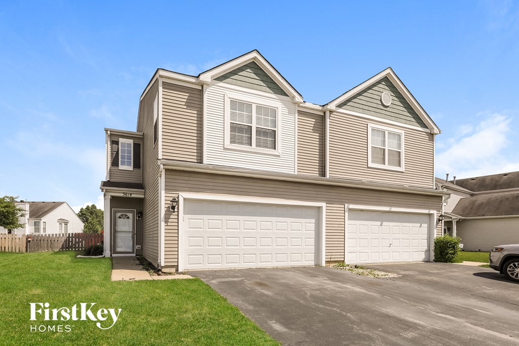 a tan and with a white garage door