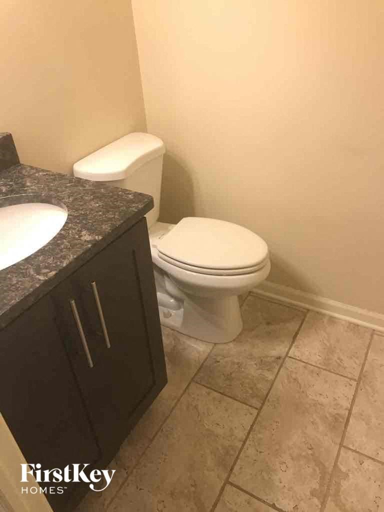 a bathroom with a toilet and a sink