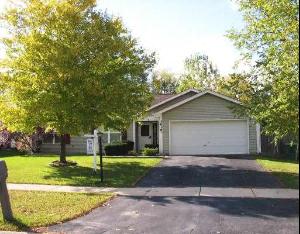 a house with a white garage door on a street