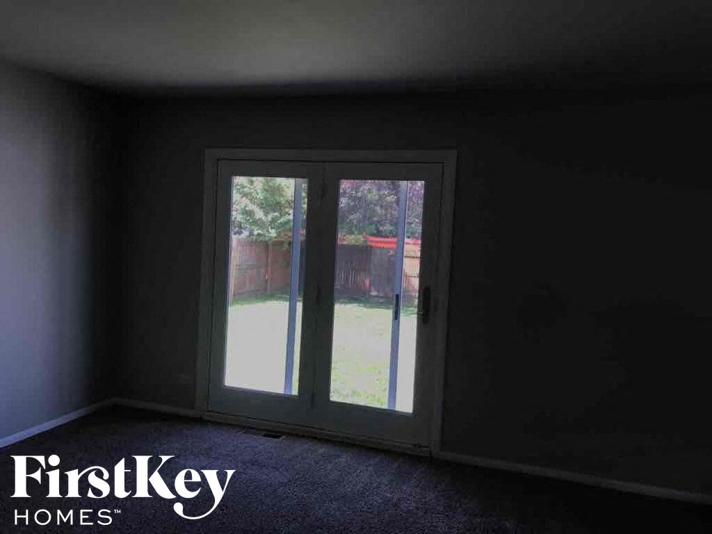 a empty room with a glass door in it