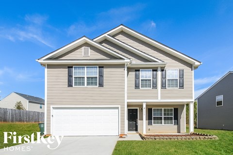 A two-story house with a garage is for sale by Firstkey Homes.