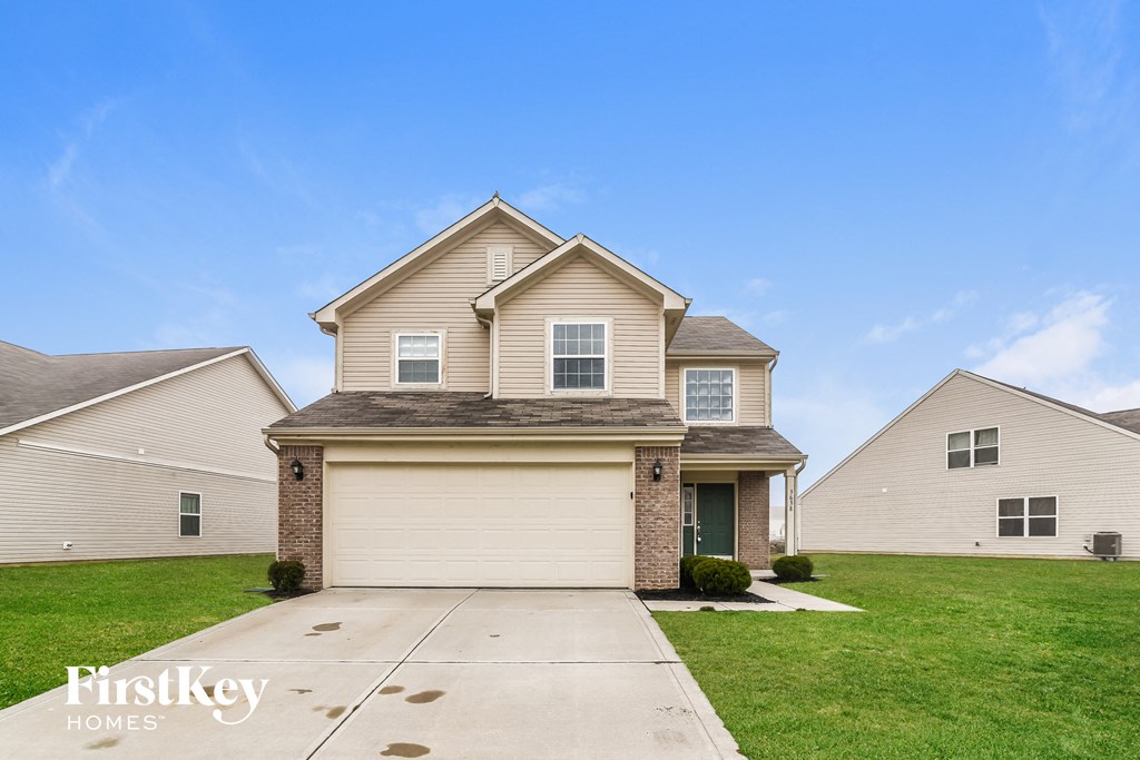 A house with a garage is for sale by FirstKey Homes.
