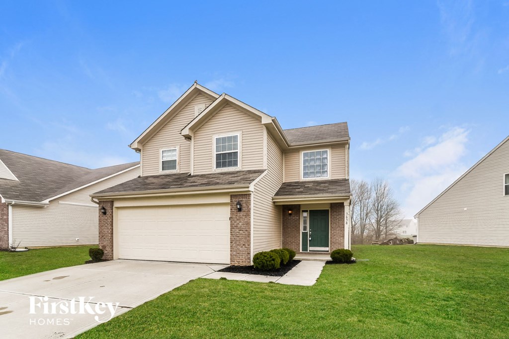 A house with a garage and a front door.