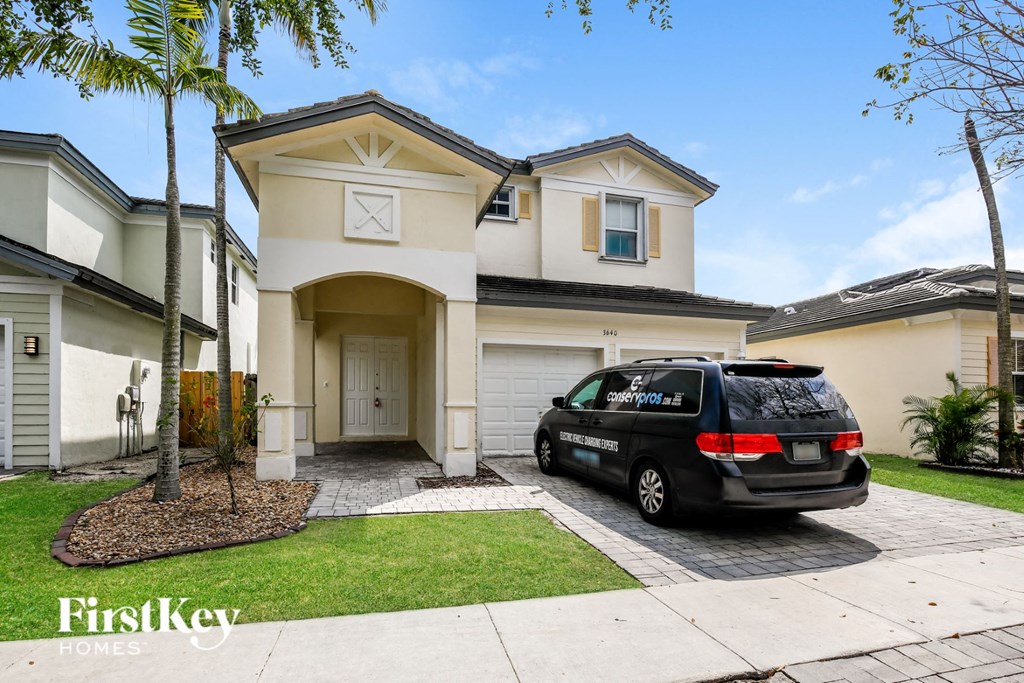 a car parked in front of a house