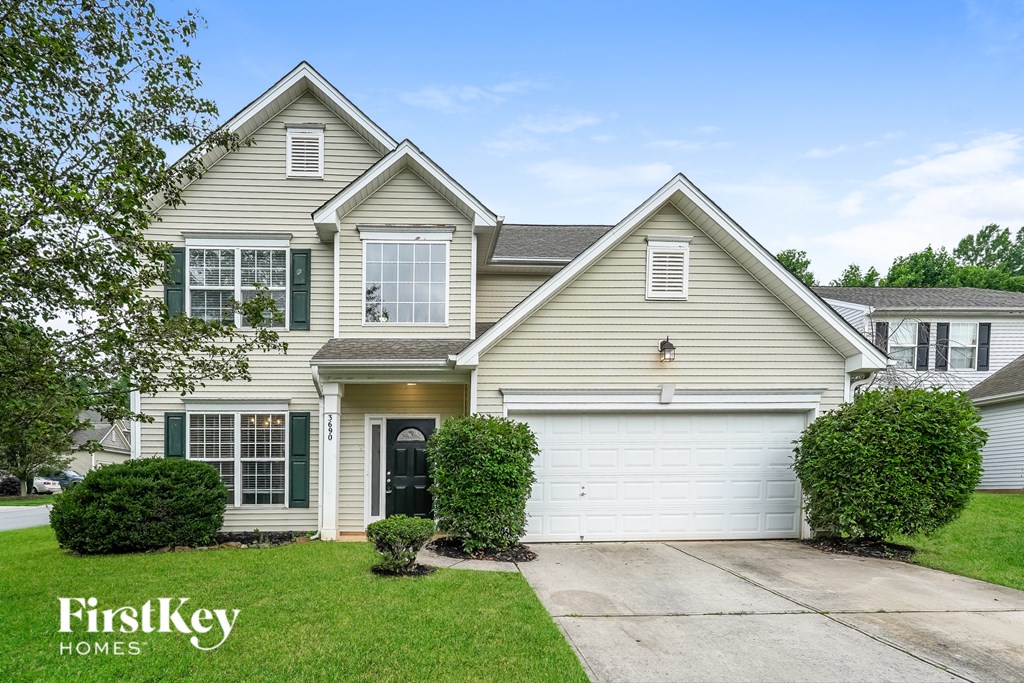 A two-story house with a garage is for sale by FirstKey Homes.