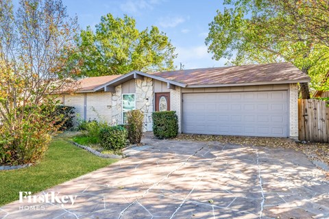 A house with a garage is for sale.