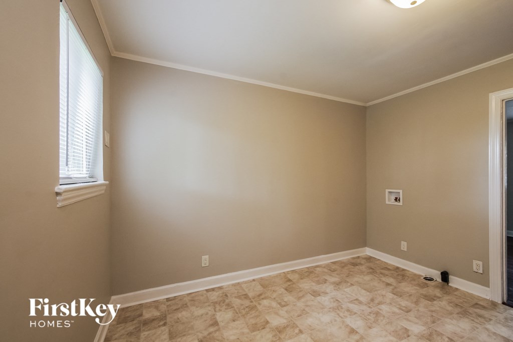 the living room after remodeling with new flooring and a window