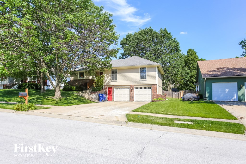A house with a garage is for sale by FirstKey Homes.