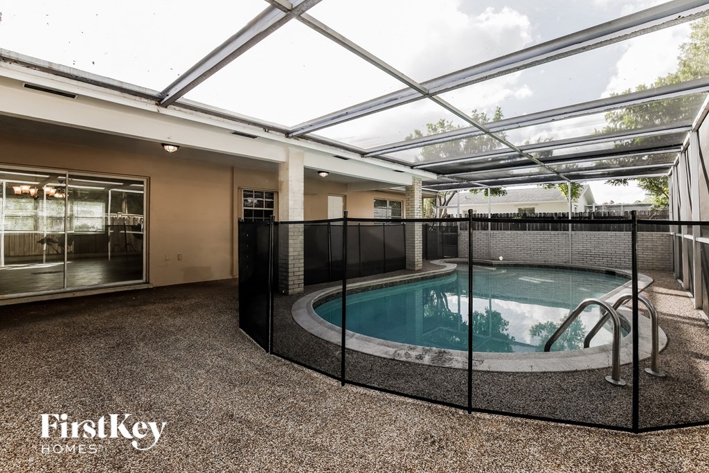 a spa with a pool in a room with a glass ceiling