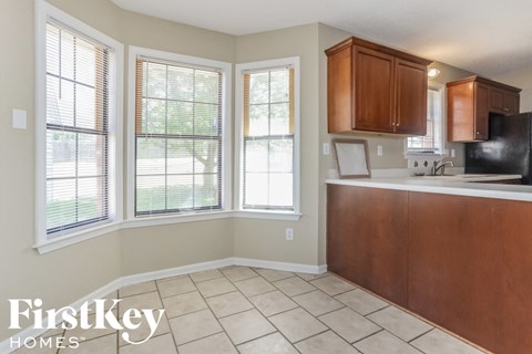 a kitchen with a sink and some windows