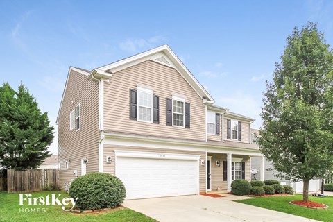 a suburban house with a white garage door