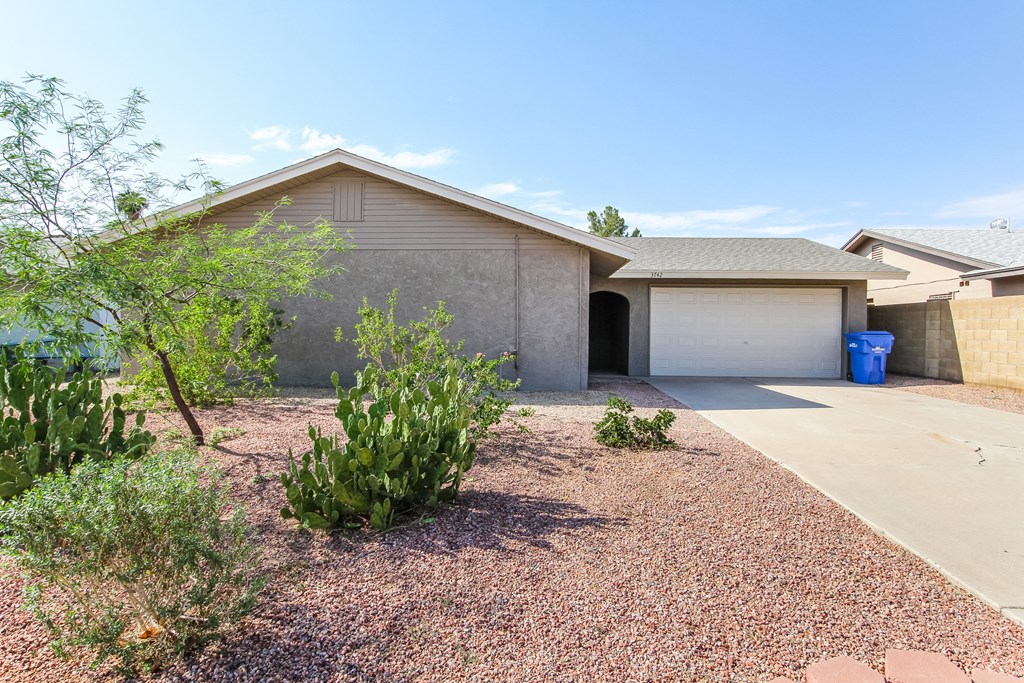 a house with a driveway and a garage door