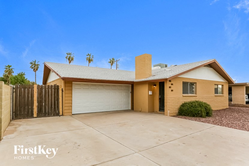 a home with a driveway and a garage door