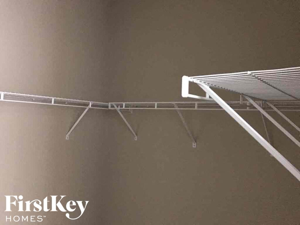 a bunk bed in a room with a brown wall