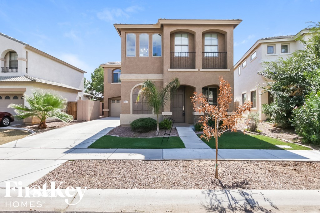 a house with a sidewalk and lawn in front of it