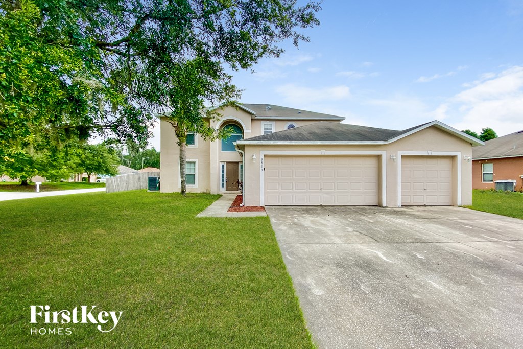 a house with a driveway and a garage door