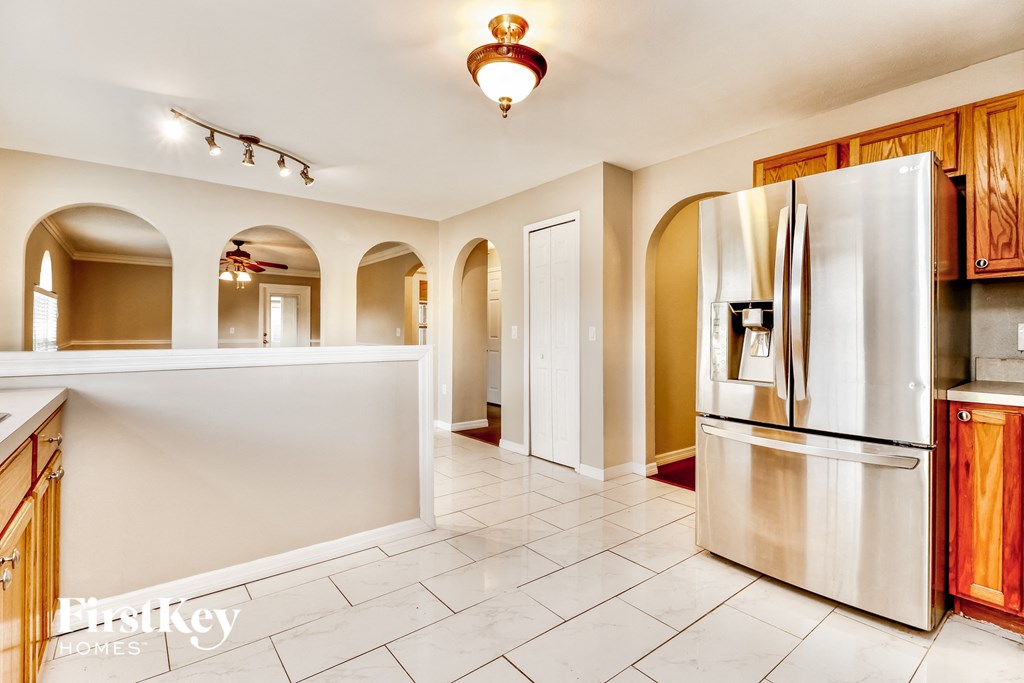 a kitchen with a counter top and a refrigerator