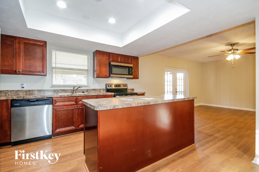 a kitchen with wooden cabinets and a counter top