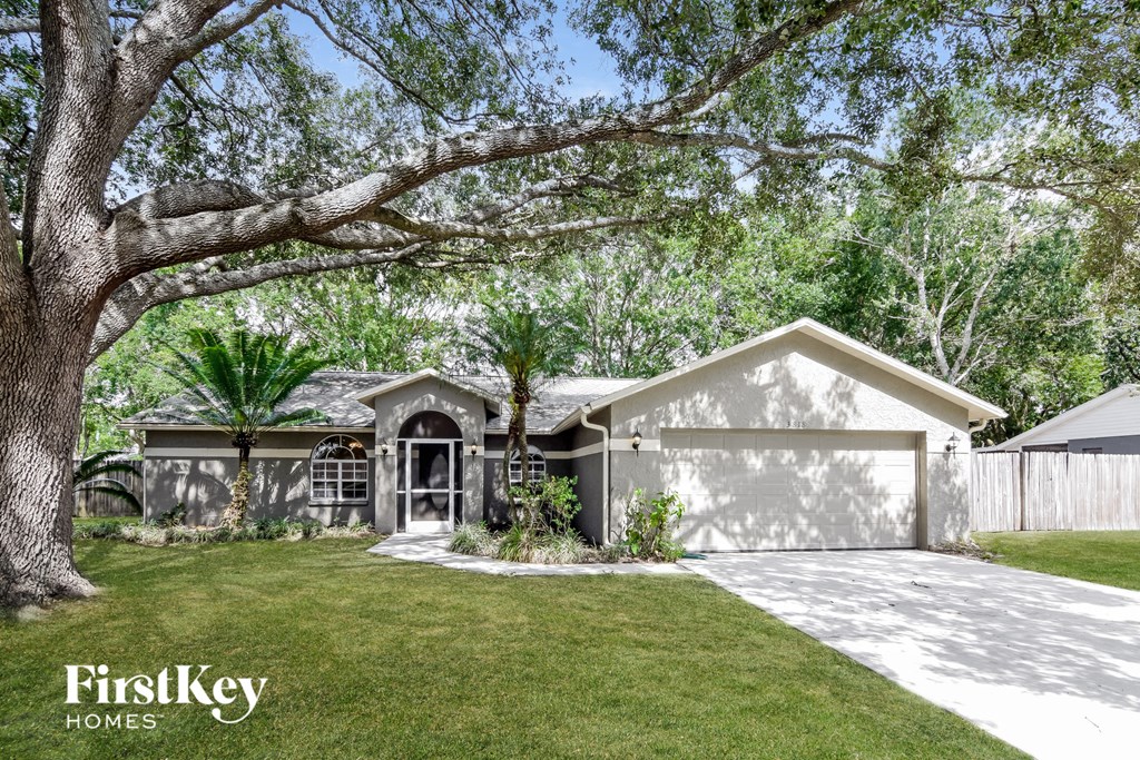A house with a tree in front of it.
