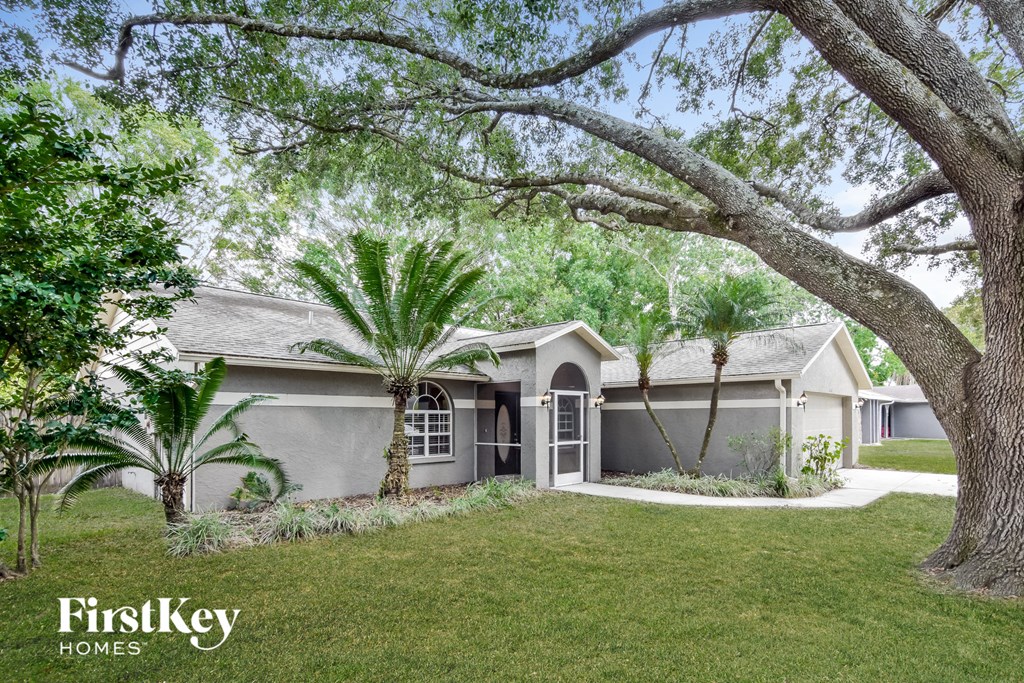 A house with a tree in front of it.