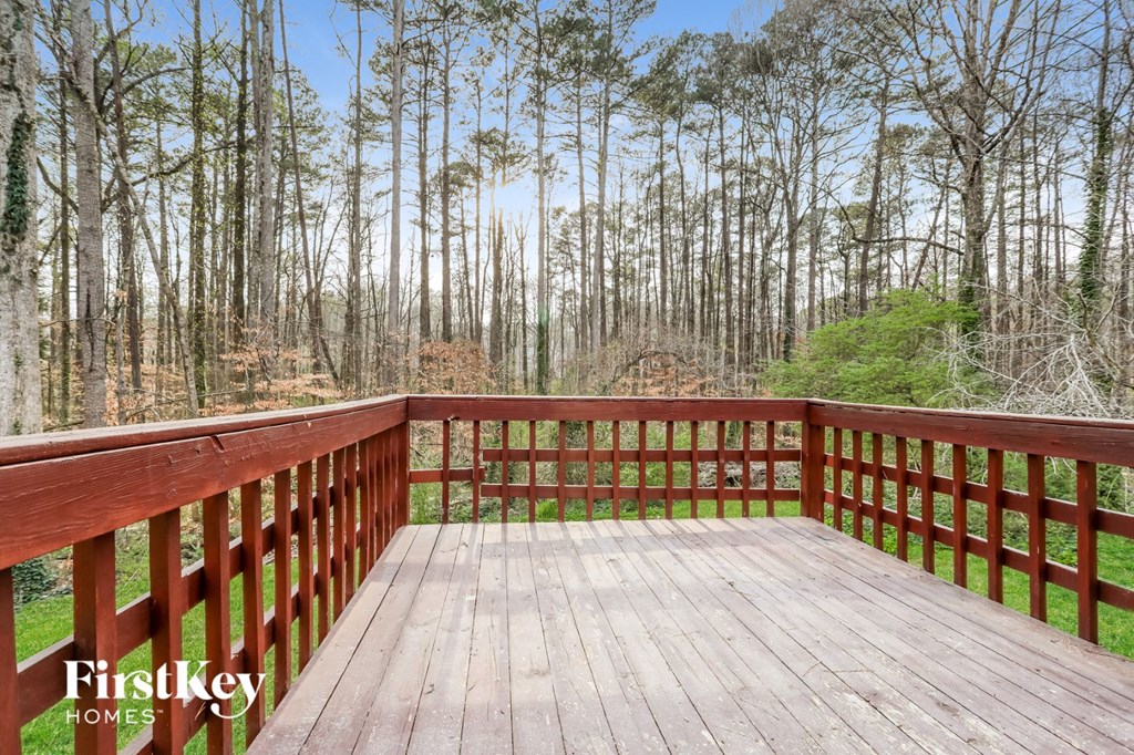 a deck with a view of the woods
