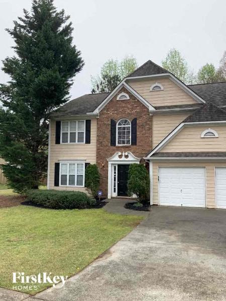 a house with a driveway in front of it