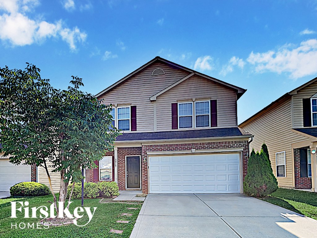 A house with a garage is for sale by FirstKey Homes.