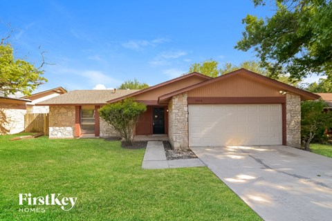 a house with a driveway and a garage door