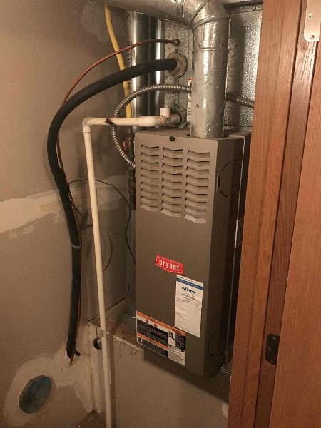 a heating unit in the corner of a room