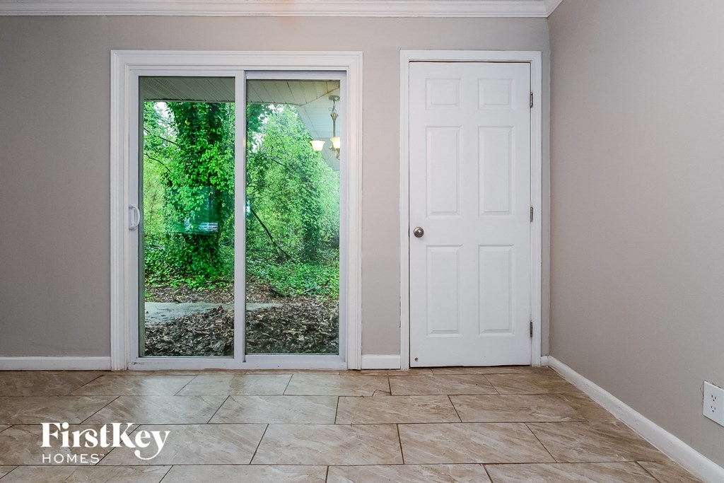a room with a door to a garden