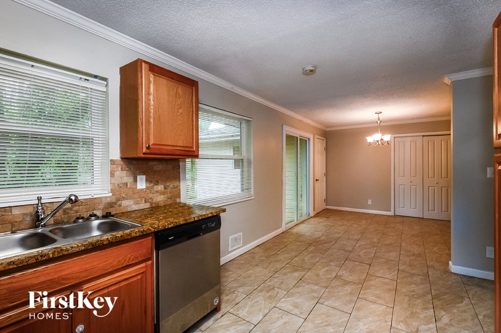 a kitchen with a sink and a dishwasher