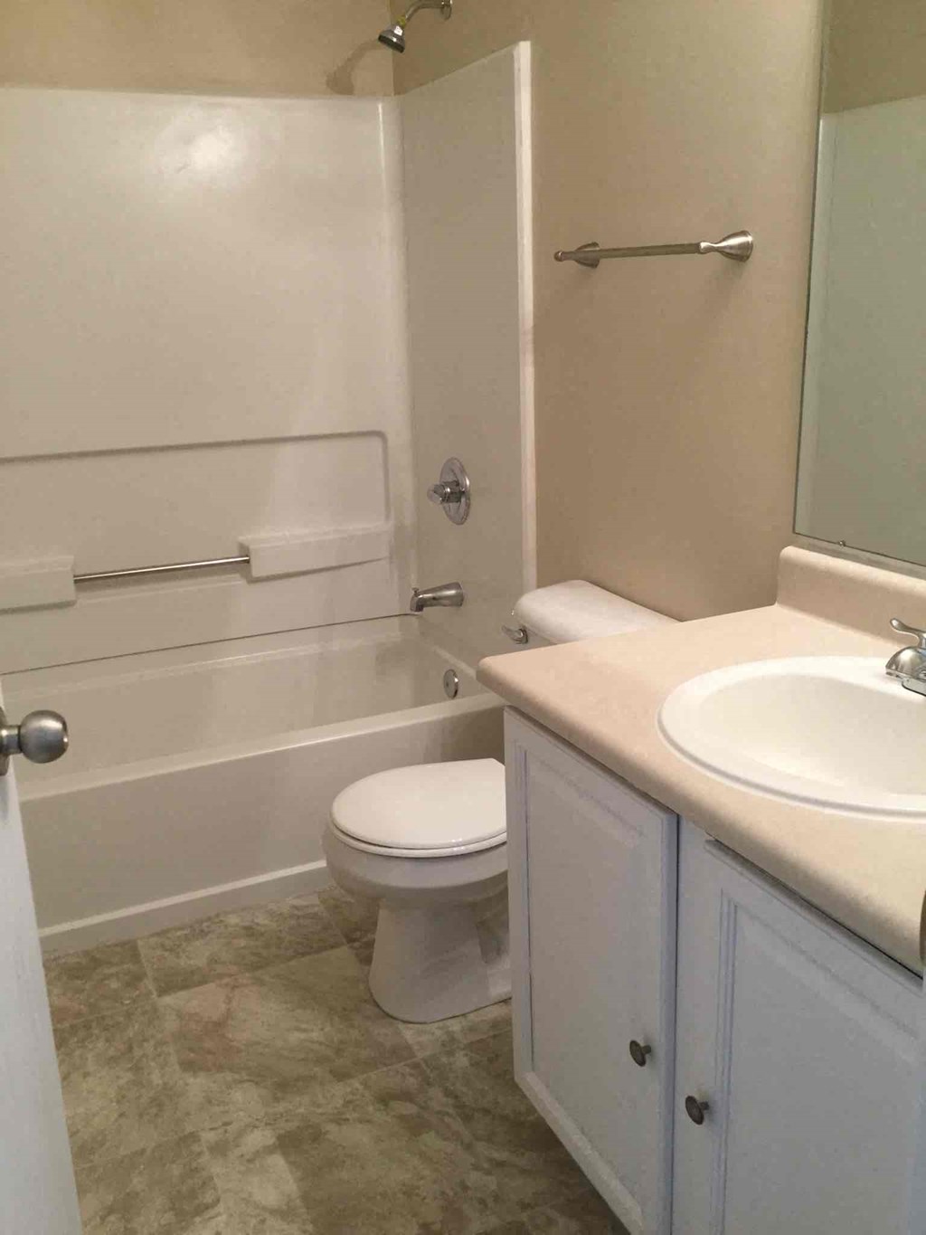 a bathroom with a sink toilet and a bath tub
