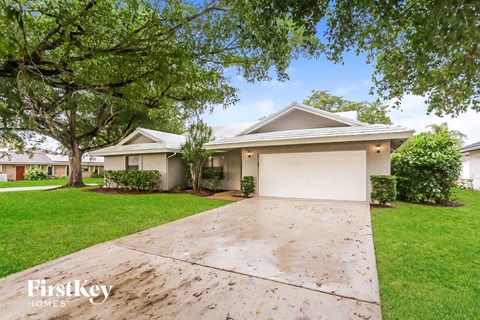 A house with a driveway in front of it.