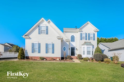 a white house with blue sky in the background