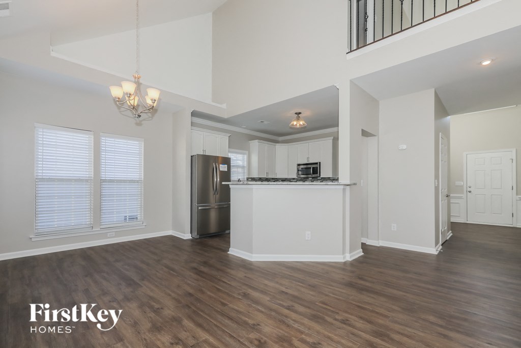 the kitchen and living room of an open floor plan