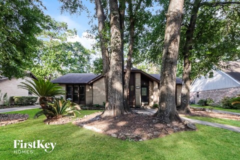 a house with trees in front of it