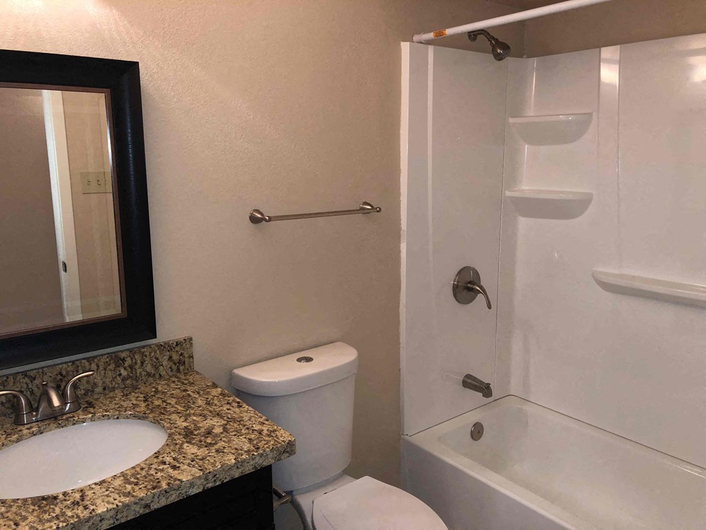 a bathroom with a sink toilet and a shower