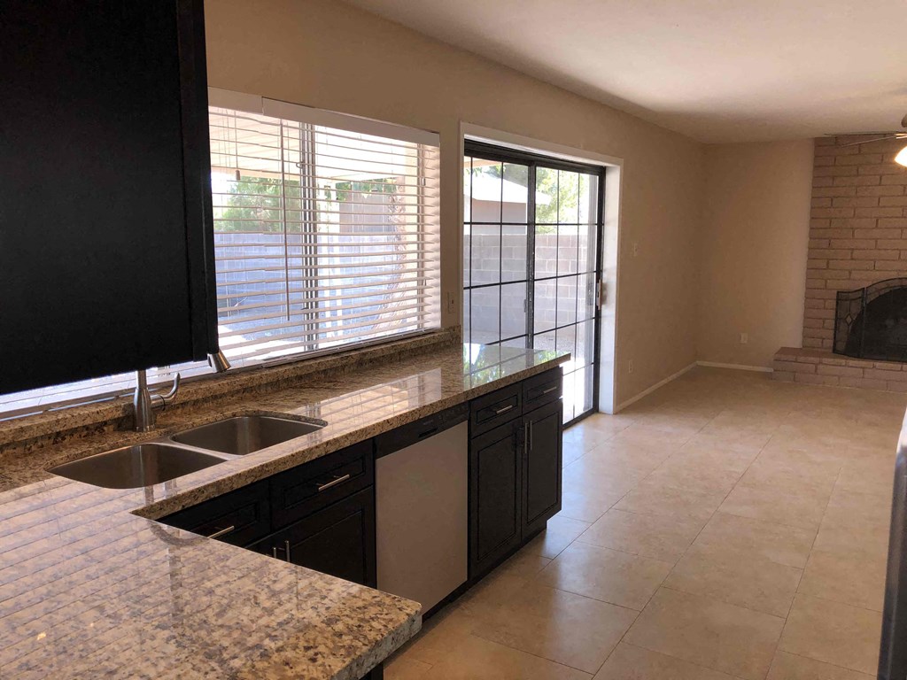 a kitchen with a counter top and a sink