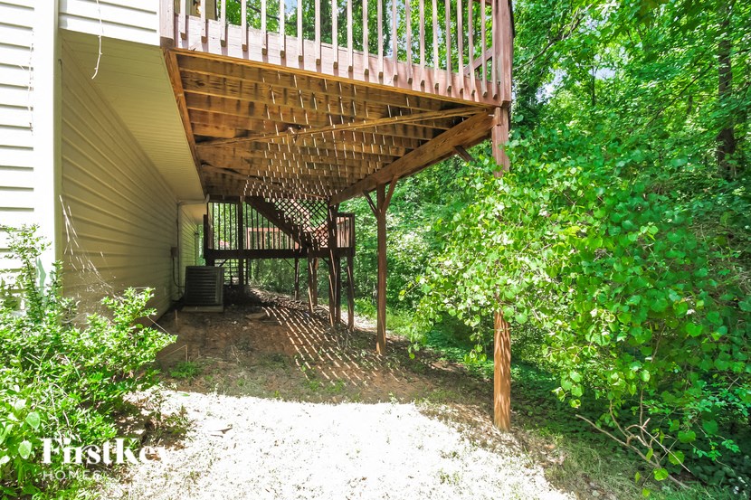 the stairs under the deck of a house