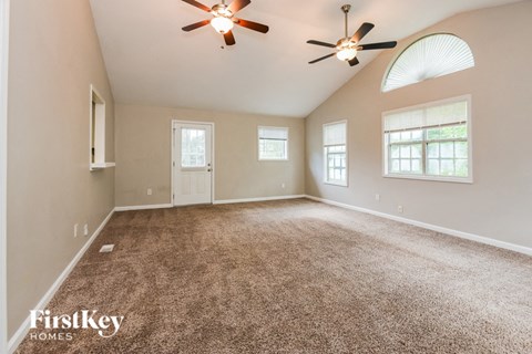the master bedroom is spacious and has a ceiling fan