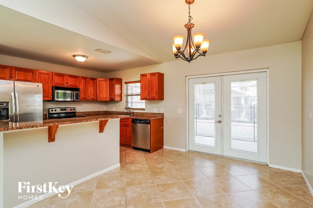 the kitchen is open to the dining room and living room
